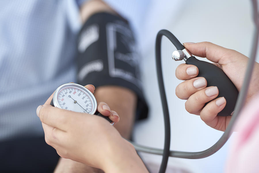Measuring blood pressure Photograph by Stockvisual