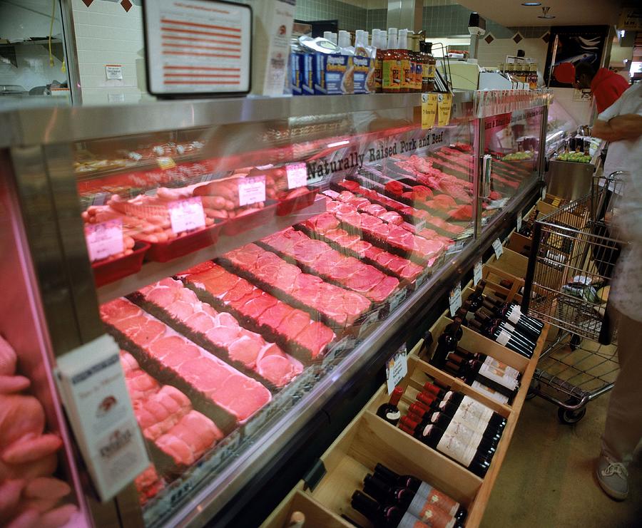 Meat counter in market Photograph by Jupiterimages