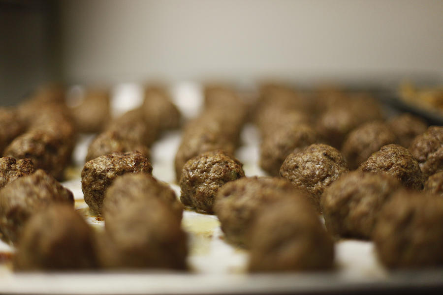 Meatballs baked on a cookie sheet Photograph by Elisa Cicinelli
