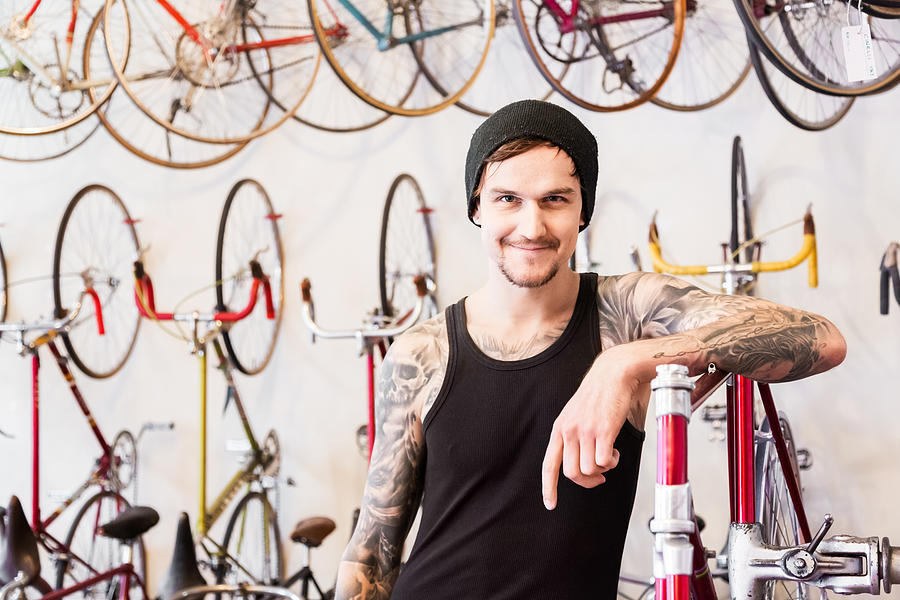 Mechanic in a Bike Store Photograph by TommL