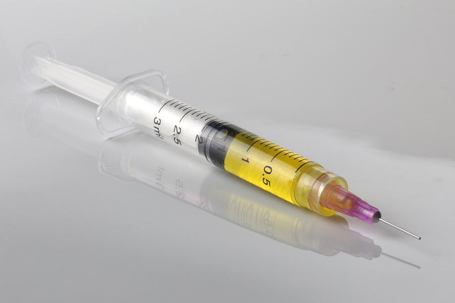 Medical Syringe filled with a small dosage of Anobolic Steroid Photograph by Douglas Sacha