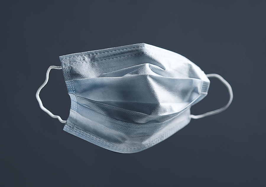 Medical Used Face Mask, Protects Against Virus. Concept Of Air Pollution, Pneumonia Outbreaks, Coronavirus Epidemics, And The Risk Of Biological Contamination. Photograph by Aleksandr Zubkov