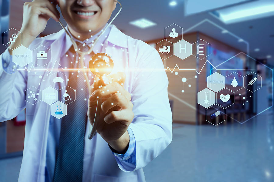 Medicine doctor and stethoscope in hand touching icon medical network connection with modern virtual screen interface, medical technology network concept Photograph by Busakorn Pongparnit