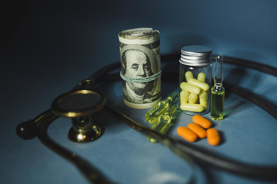 Medicine pills or capsules with money, dollar. Medical or pharmacy prescription for health. Business, finance concept. Cost of the healthy life. Bottle of drug Photograph by Andrei Orlov