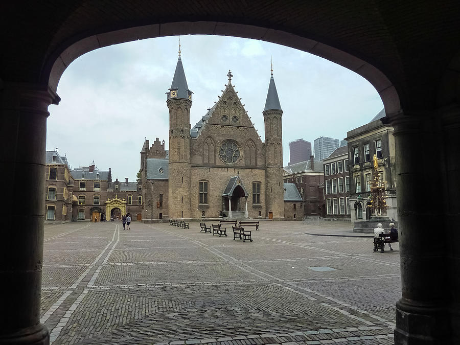 Medieval Ridderzaal facade as seen from the Binnenhofs (Dutch Parliament) internal arches at dusk in The Hague, The Netherlands Photograph by Sir Francis Canker Photography
