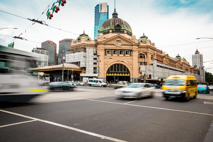 Melbourne train station with traffic in motion blur. Photograph by Tempura