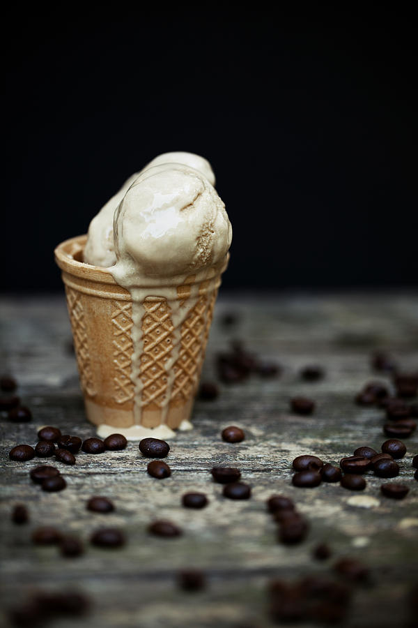 Melting coffee ice cream in cone Photograph by Laura Stolfi