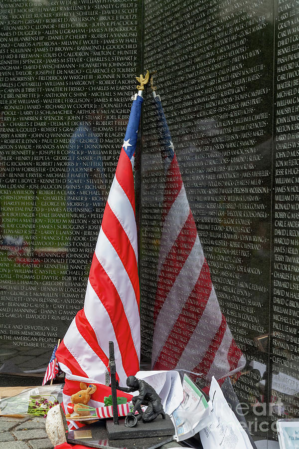 Mementoes left at The Wall, the Vietnam Veterans Memorial, in Wa Photograph by William Kuta