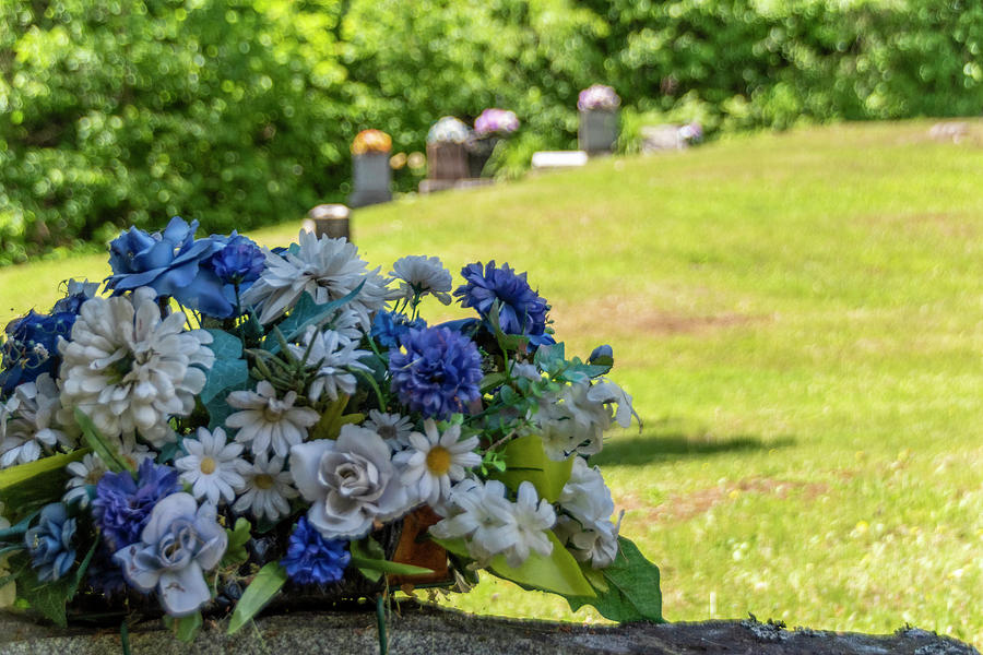 Memorial Flowers In A Cemetery Photograph