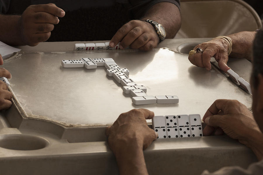 Men enjoying dominos Photograph by David Sacks