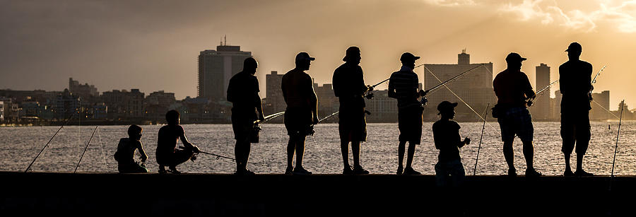 Men fishing from Havanas seawall Photograph by Wellsie82