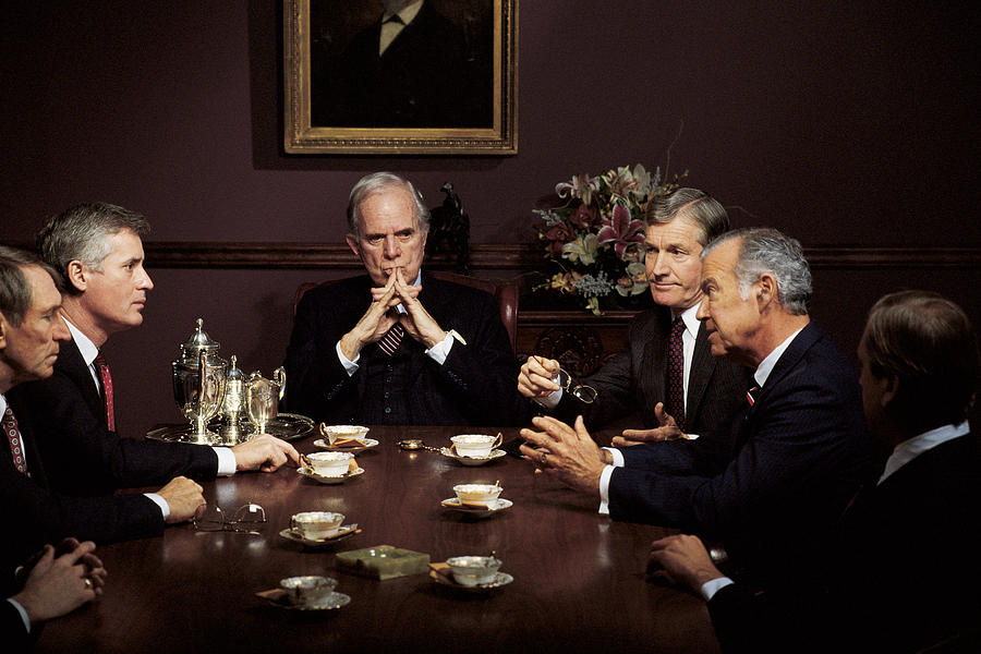 Men in business meeting Photograph by Comstock