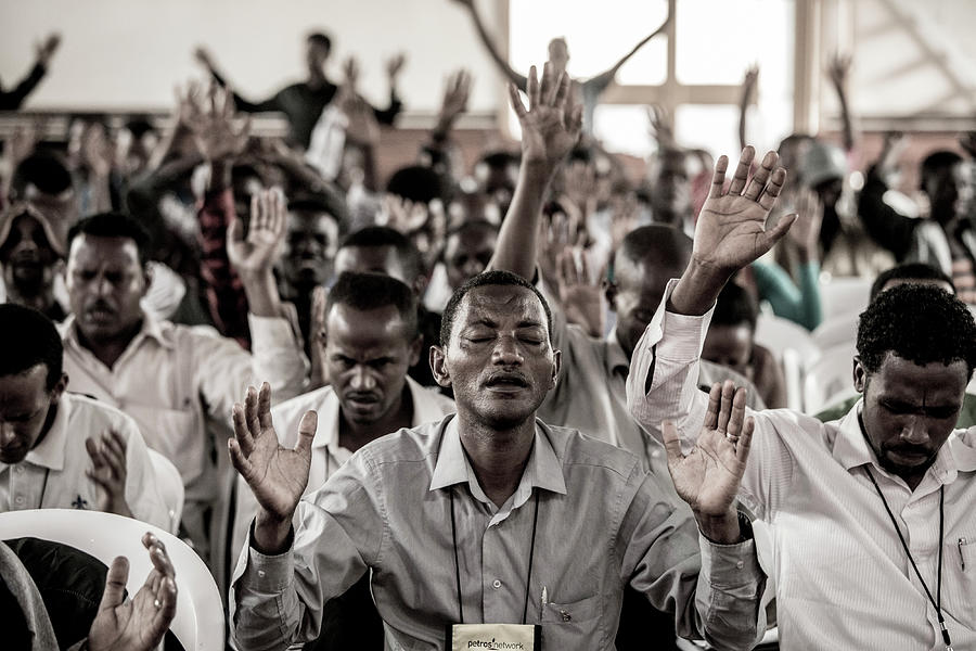 Men praying with lifted hands Photograph by John Wollwerth - Pixels