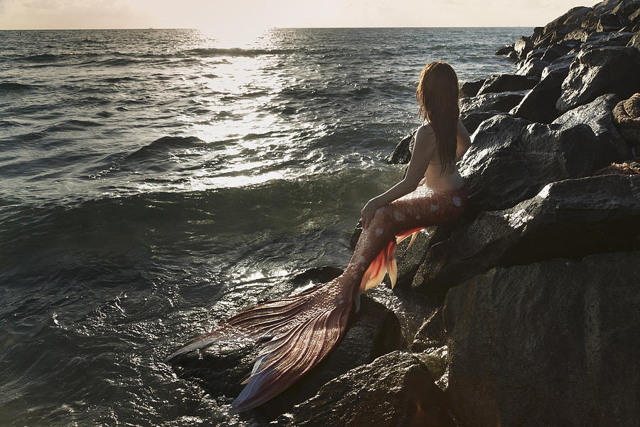 Mermaid watching  sunset Photograph by Buena Vista Images
