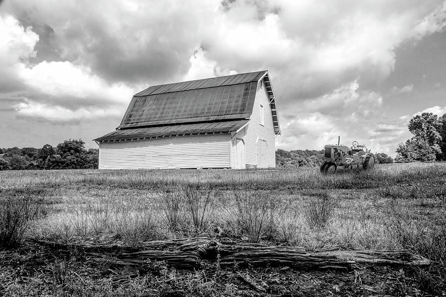 Metal Roof Barn and Old Tractor Black and White Photograph by Debra and Dave Vanderlaan