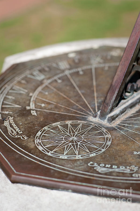 Metal sundial in garden Photograph by Dariusz Gora