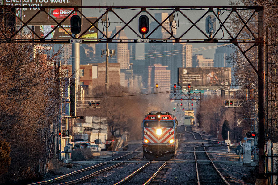Metra engine 141 heads up an evening commuter  train Photograph by Jim Pearson