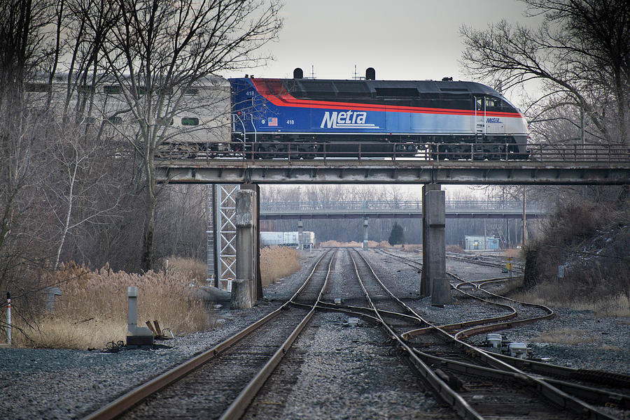 Metra engine 418 crosses over the CSX Elsdon Subdivision at Blue Island Illinois Photograph by Jim Pearson