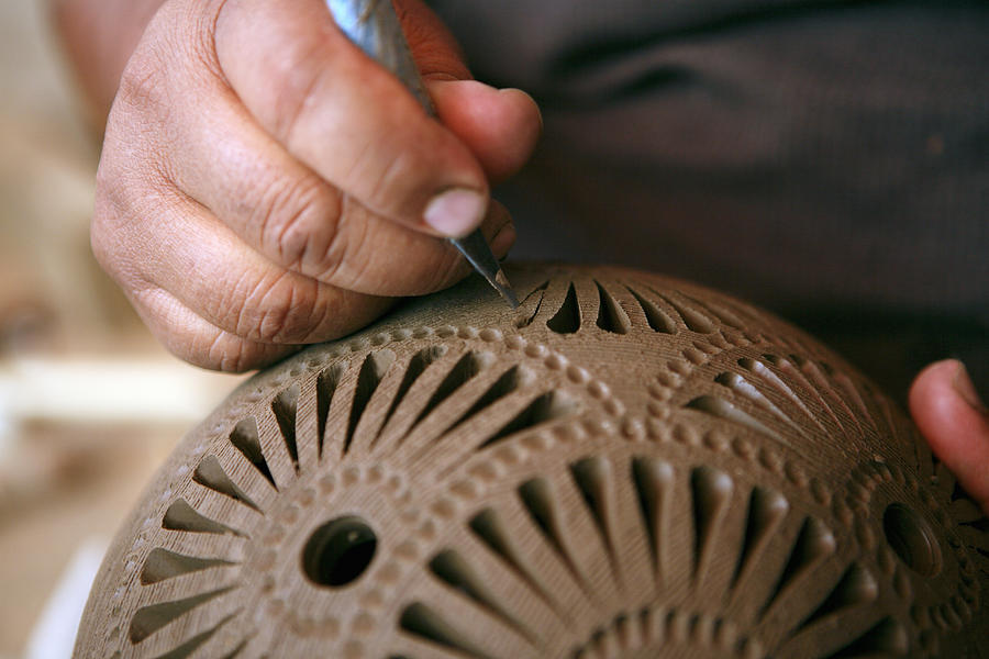 Mexico, Oaxaca, man making black ceramic decorative pottery, close-up of hands Photograph by Monica Rodriguez
