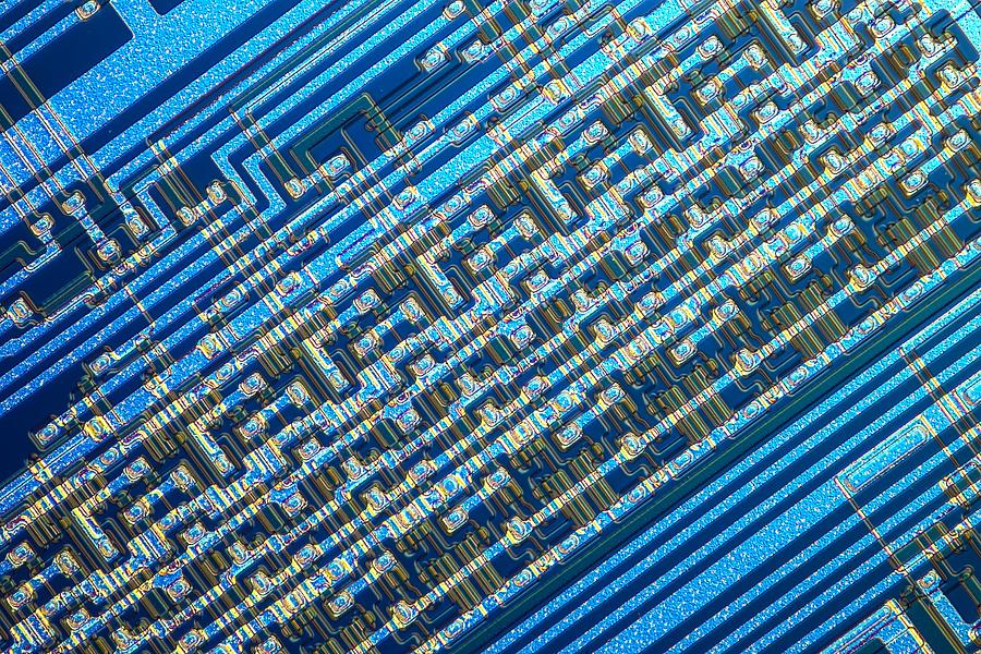Microchip, light micrograph Photograph by Alfred Pasieka/science Photo Library