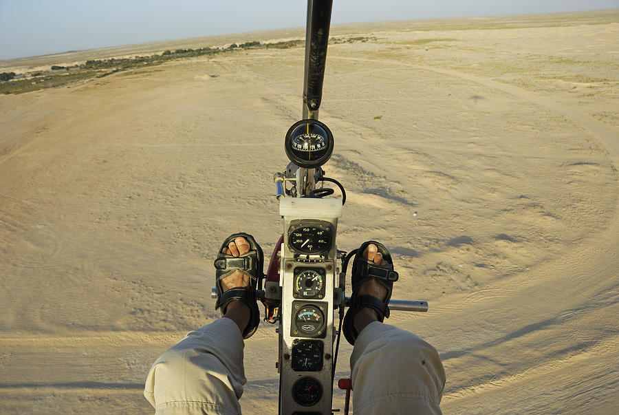 Microlite plane pilot, flying over Sahara desert Photograph by Sami Sarkis