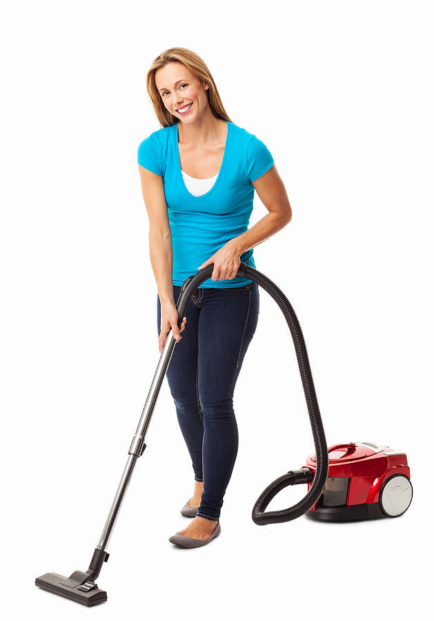 Mid Adult Woman Vacuum Cleaning - Isolated Photograph by Neustockimages
