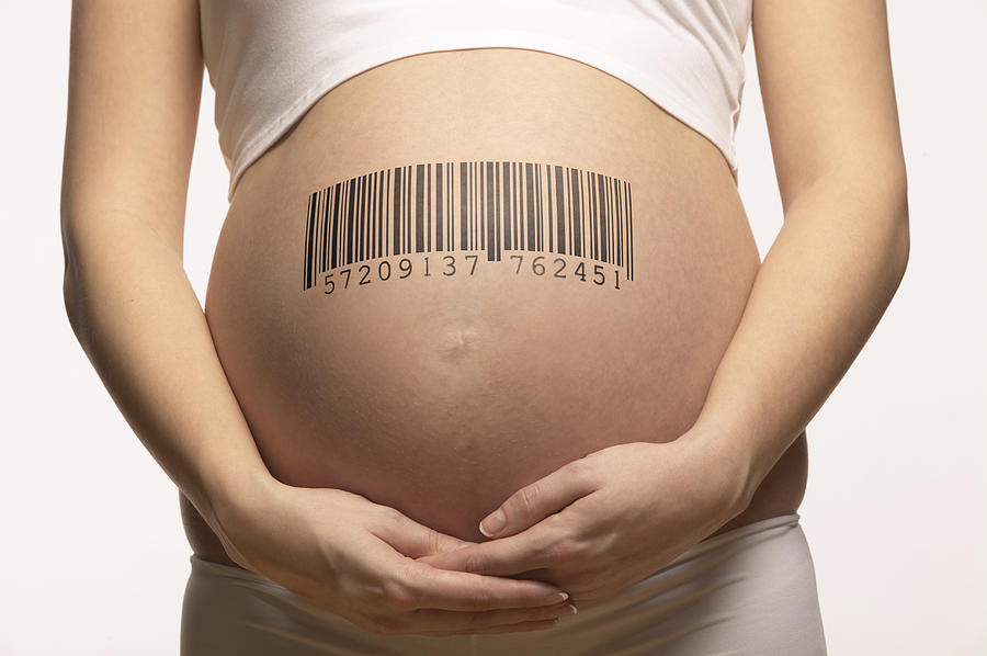 Mid section of a Pregnant Woman With a Barcode on Her Stomach Photograph by Nick White