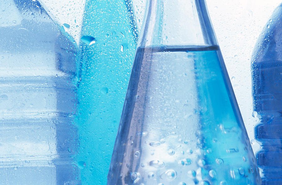 Mid section of cold bottled water, close up Photograph by Achim Sass