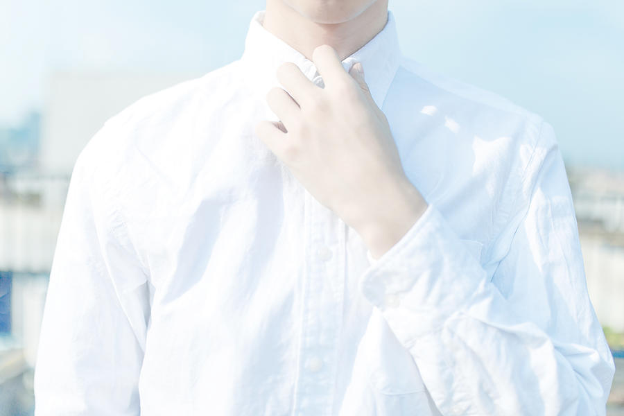 Mid-section shot of man wearing white button-down shirt Photograph by York