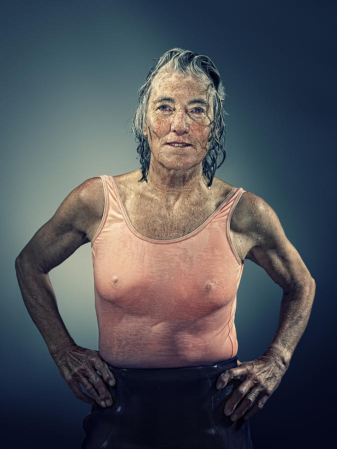 Middle aged female surfer with wet hair and body Photograph by Devon Strong