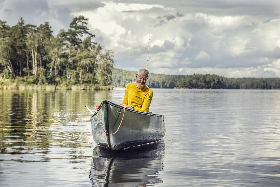 Middle aged man in a canoe. Photograph by David Trood