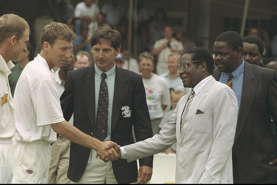 Mike Atherton the captain of England (left) meets Robert Mugabe Photograph by Clive Mason