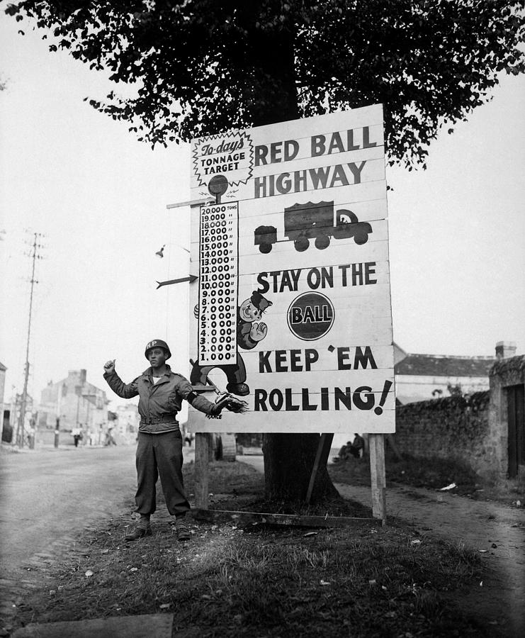 Red Ball Express Photograph - Military Policeman Next To Red Ball Express Sign - WW2 France - 1944 by War Is Hell Store