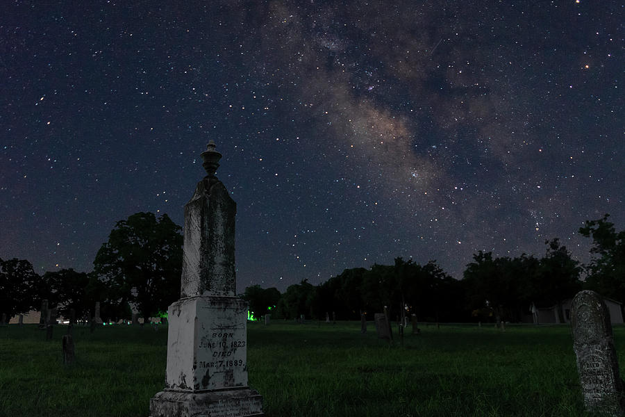 Milky Way galaxy over tombstones in cemetery Photograph by Wendell ...