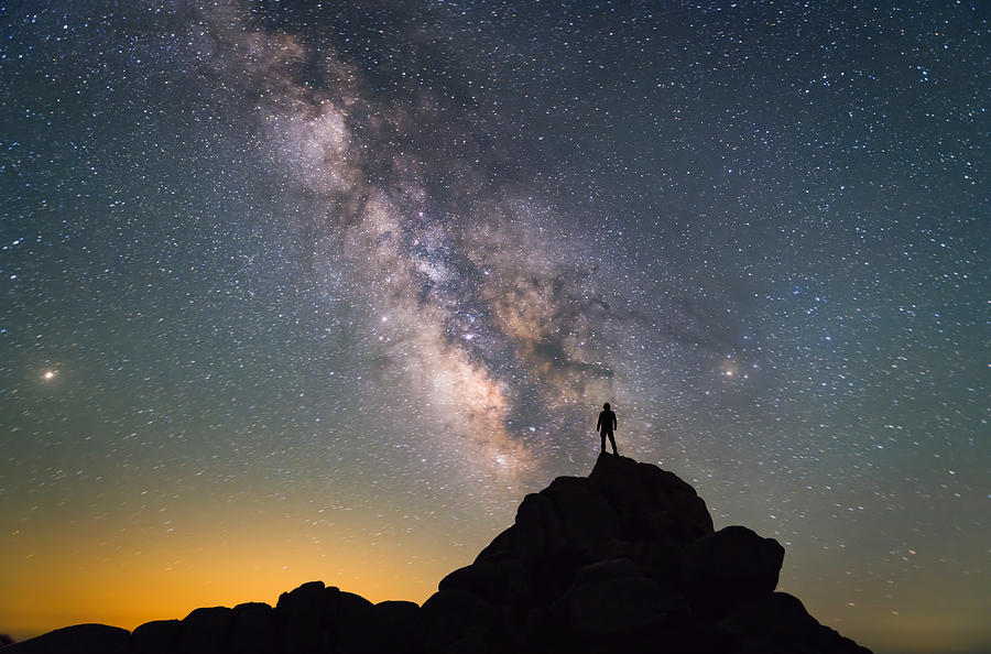 Milky Way. Night sky and silhouette of a standing man Photograph by Bjdlzx