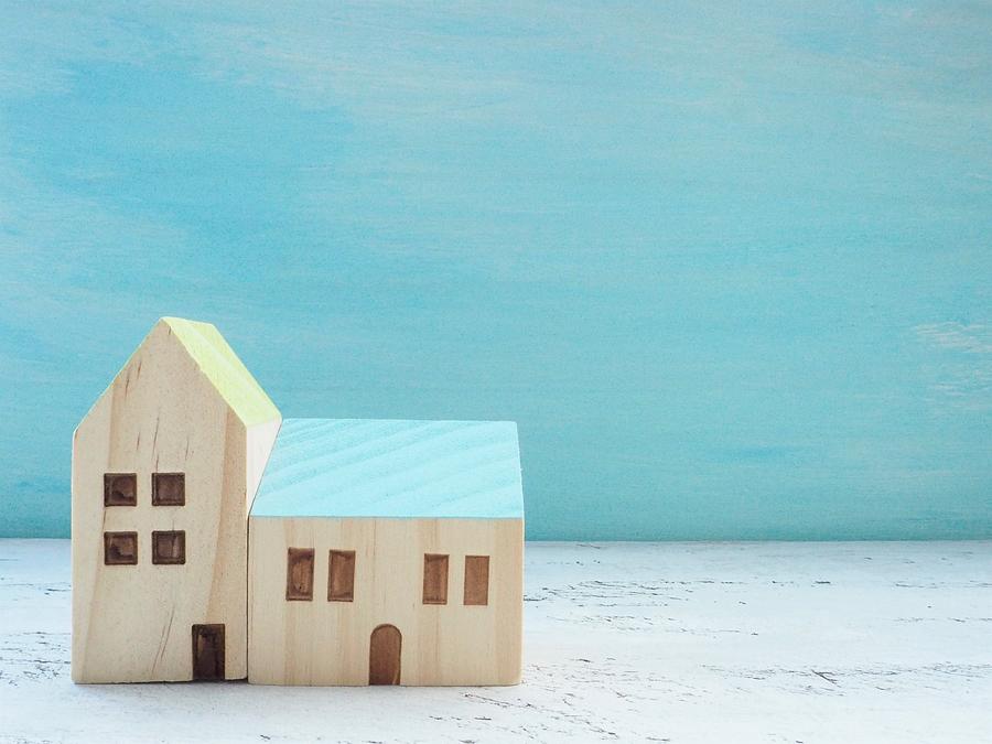 Miniature House Standing With Wooden Sky Blue Background Photograph by Poteco
