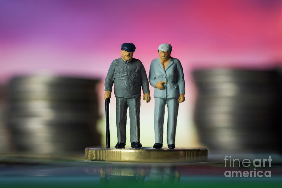Miniature people old couple walking with a cane between coin stacks sunset background. macro Photograph by Pablo Avanzini