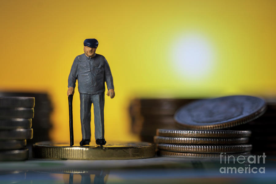 Miniature people old man walking with a cane between coin stacks sunset background. macro Photograph by Pablo Avanzini