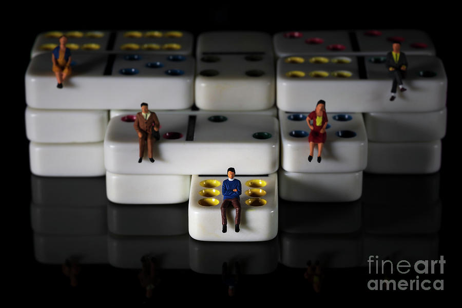miniature people on white colored dominoes Black background macro Photograph by Pablo Avanzini