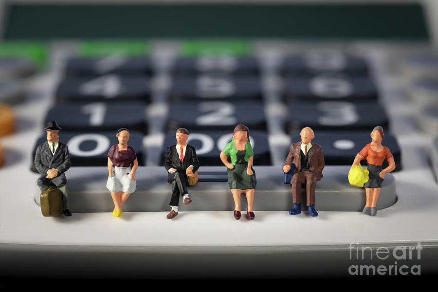 Miniature people Seniors sitting at a calculator. social security income and pensions. Saving money and Investment. social distancing. Macro Photograph by Pablo Avanzini