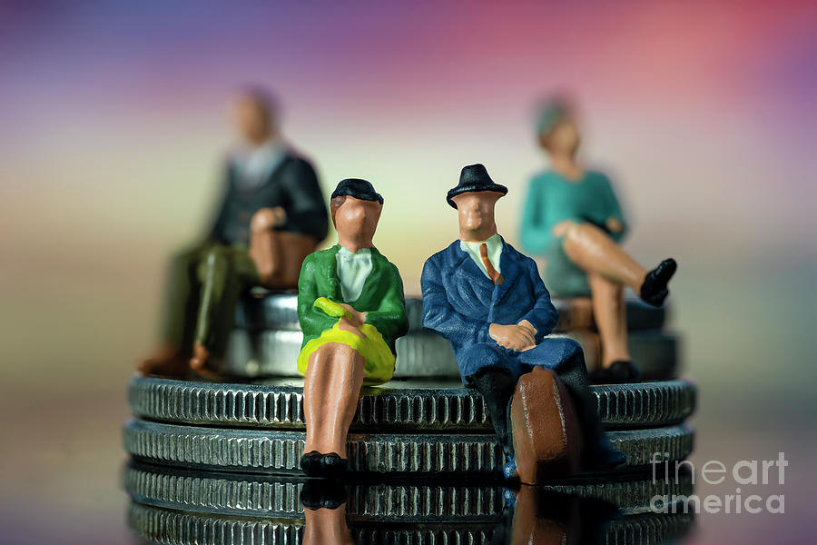 Miniature people sitting on stack of coins. Concept of financial planning for retirement. Macro Photograph by Pablo Avanzini