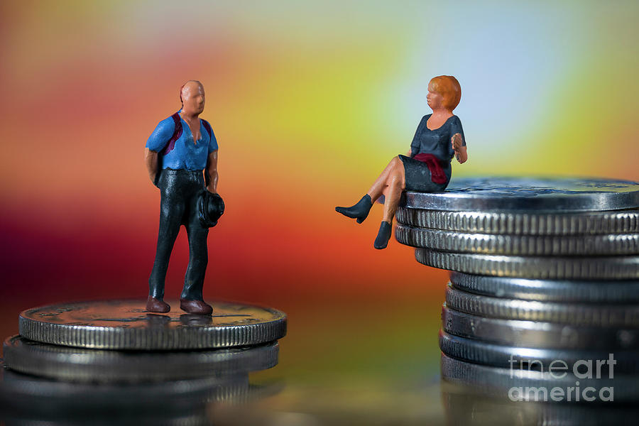 Miniature people, small figures businessmen and woman on top of coins. Money and Financial, Business Growth concept. Macro Photograph by Pablo Avanzini
