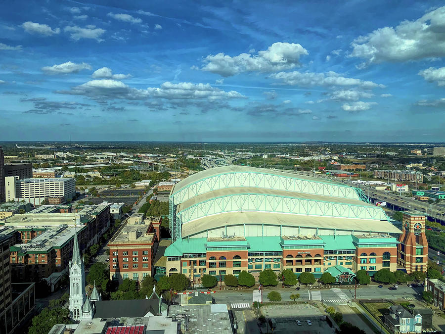 Aerial night view of Minute Maid Park with the roof opened in downtown  Houston