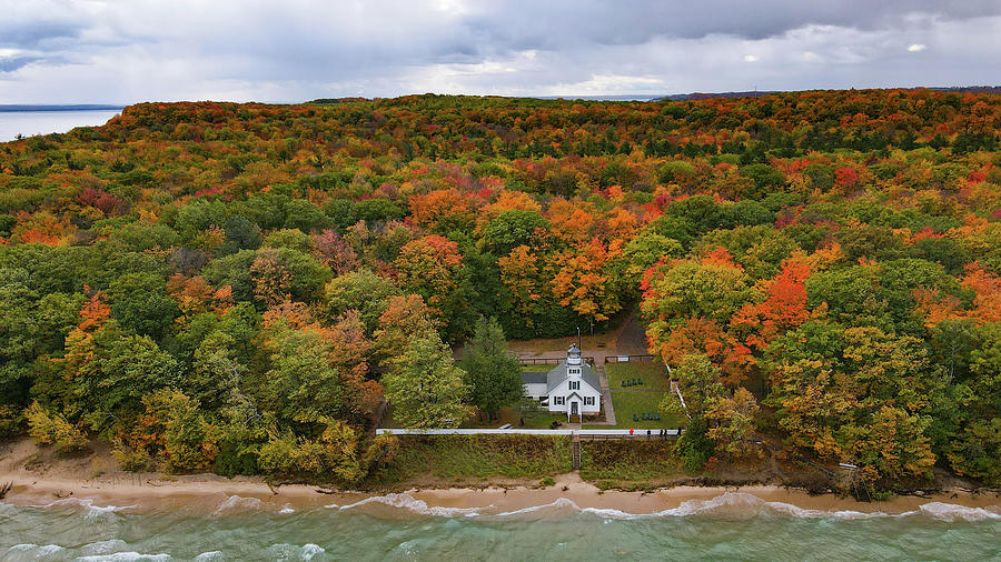 Mission Point Lighthouse with fall colors in Traverse City Michigan Photograph by Eldon McGraw