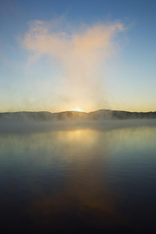 Mist rising from a lake Photograph by Scott Barrow