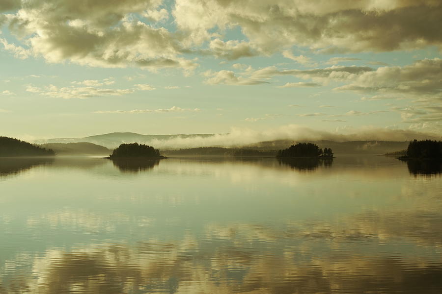 Mists are rising over tiny islands in a glassy lake at sunset Photograph by Ulrich Kunst And Bettina Scheidulin