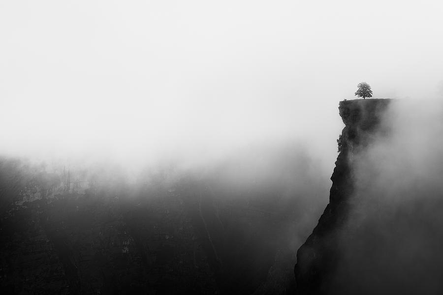 misty canyon with sharp cliff iin Delika Photograph by Mimadeo