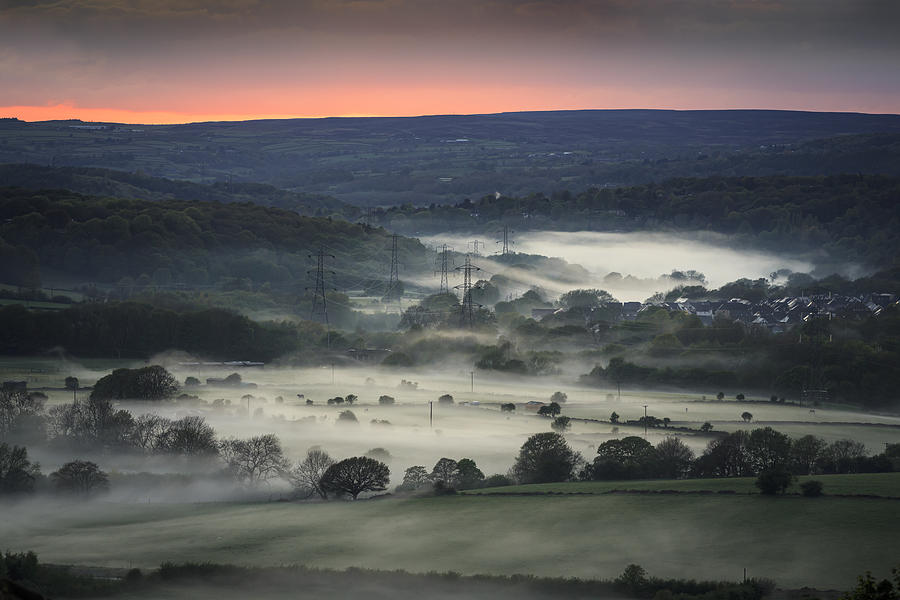 Misty valley in Leeds, Yorkshire with electricity pylons Photograph by Kelvinjay