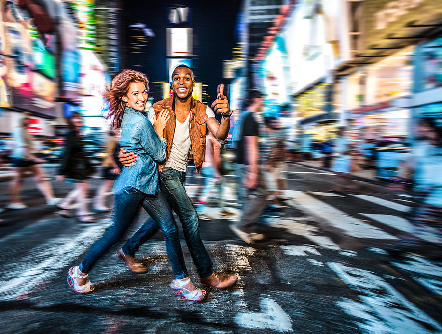 Mixed race couple walking around in New York City, pedestrian crossing Photograph by Itsskin