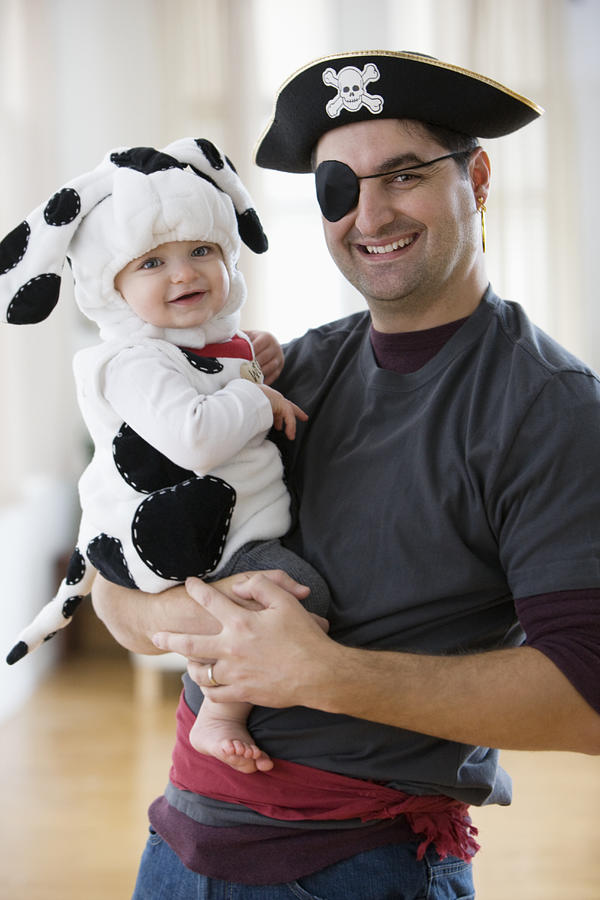 Mixed race father and baby boy in Halloween costumes Photograph by Jose Luis Pelaez Inc